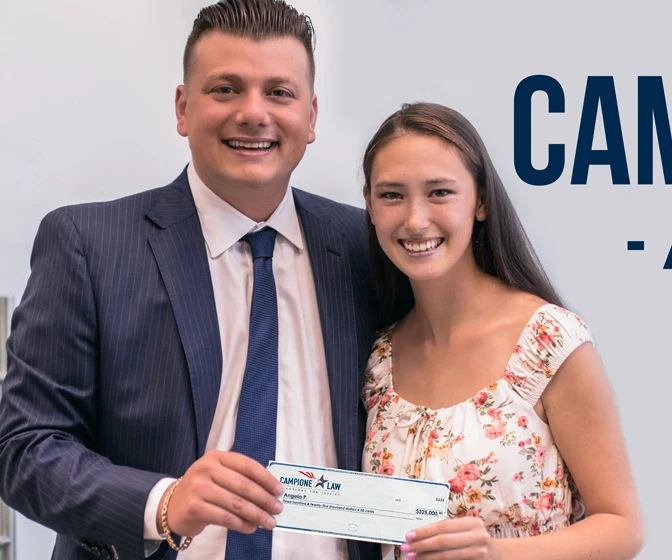 Chris with a client holding her check